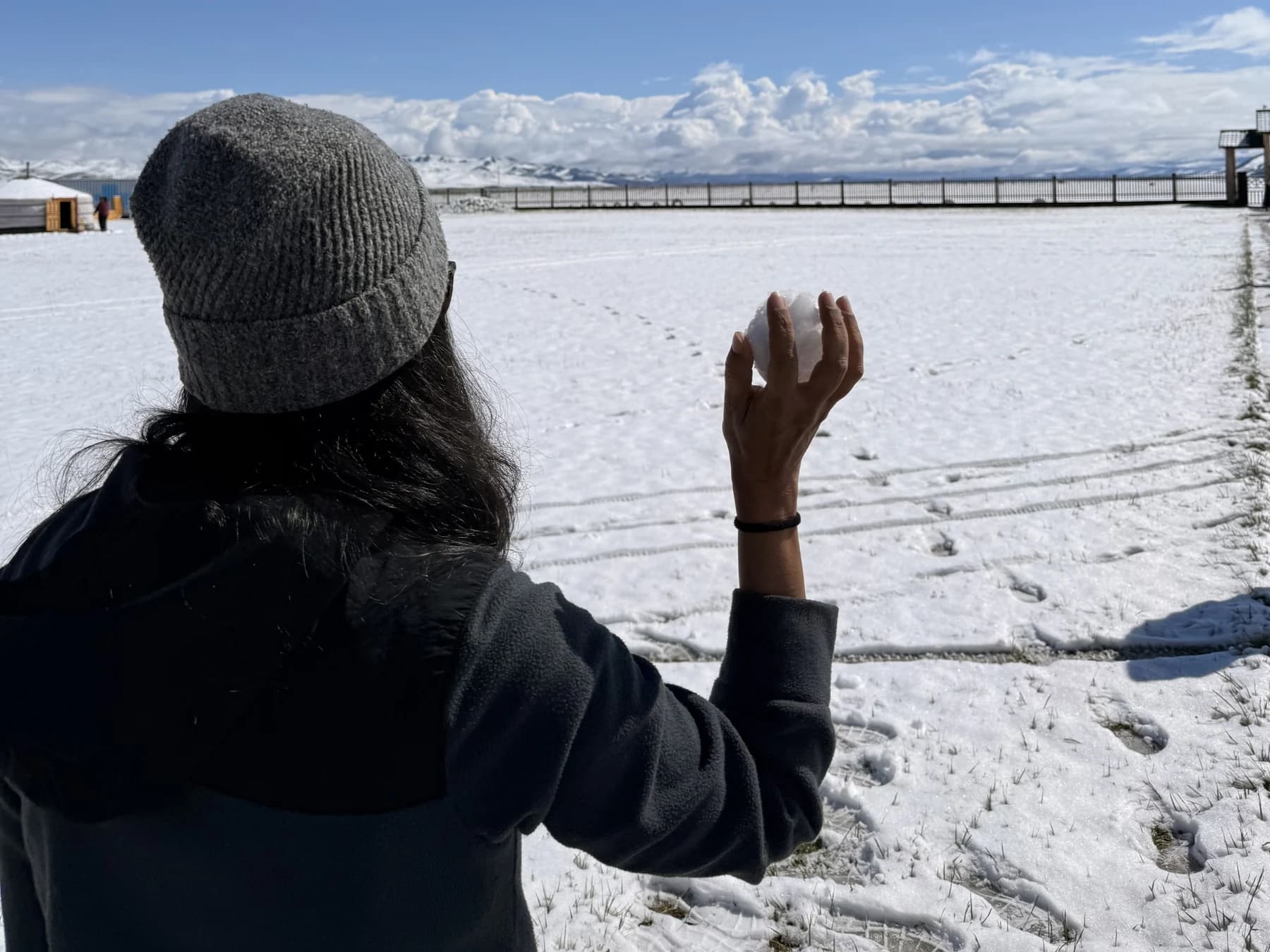 A traveler dressed for snowy weather