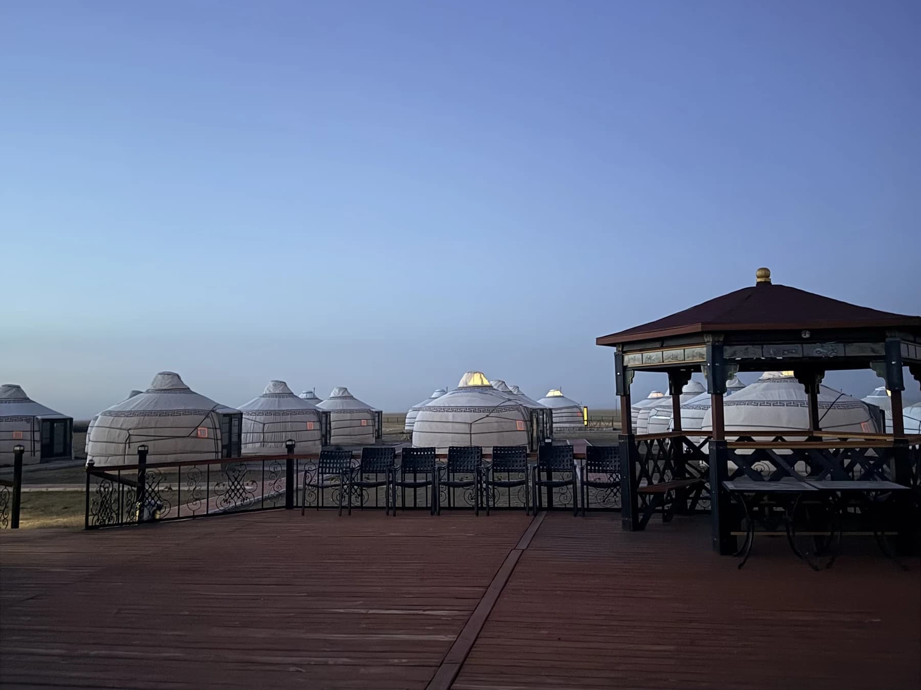 Ger camp and terrace beneath the open sky